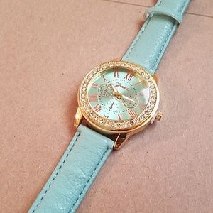 Geneva rhinestone gold face mint strap watch